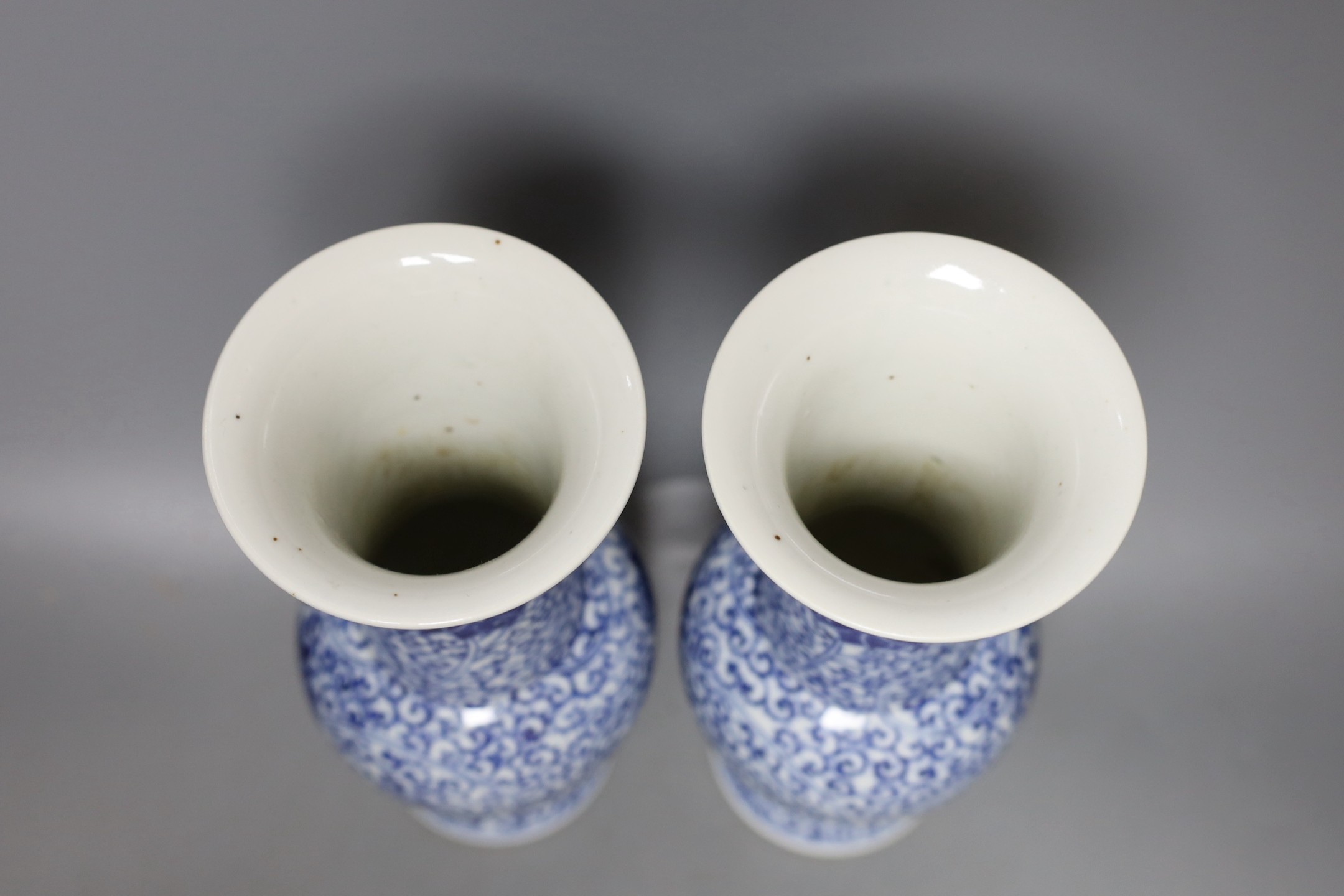 A pair of Chinese blue and white vases, 19th century, 28cm high.